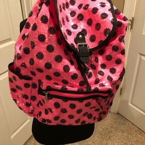 Sequin pink and black poka dot back pack.